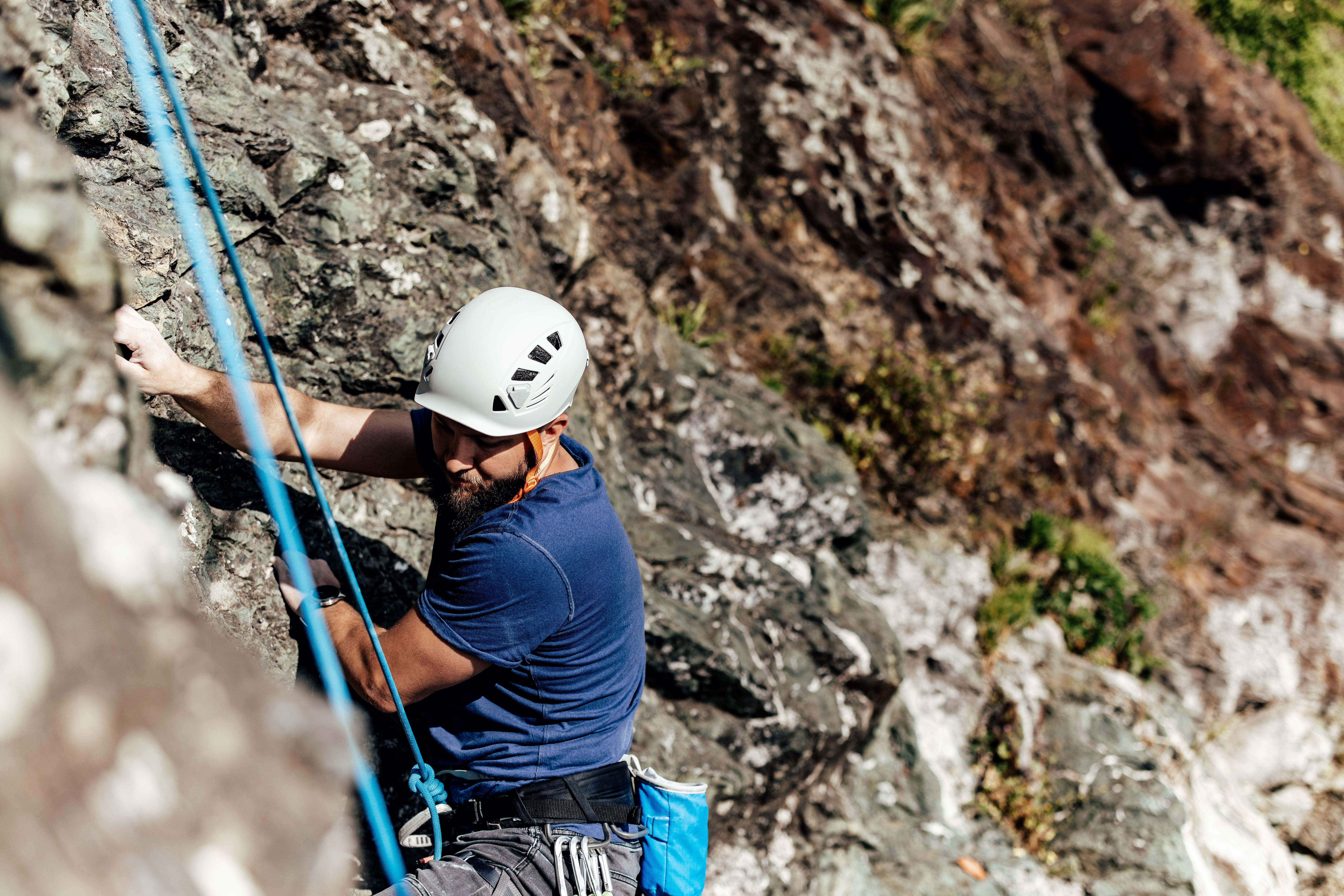 man-climbing-a-steep-rock-formation-with-climbing-2026-01-11-10-11-11-utc.jpg